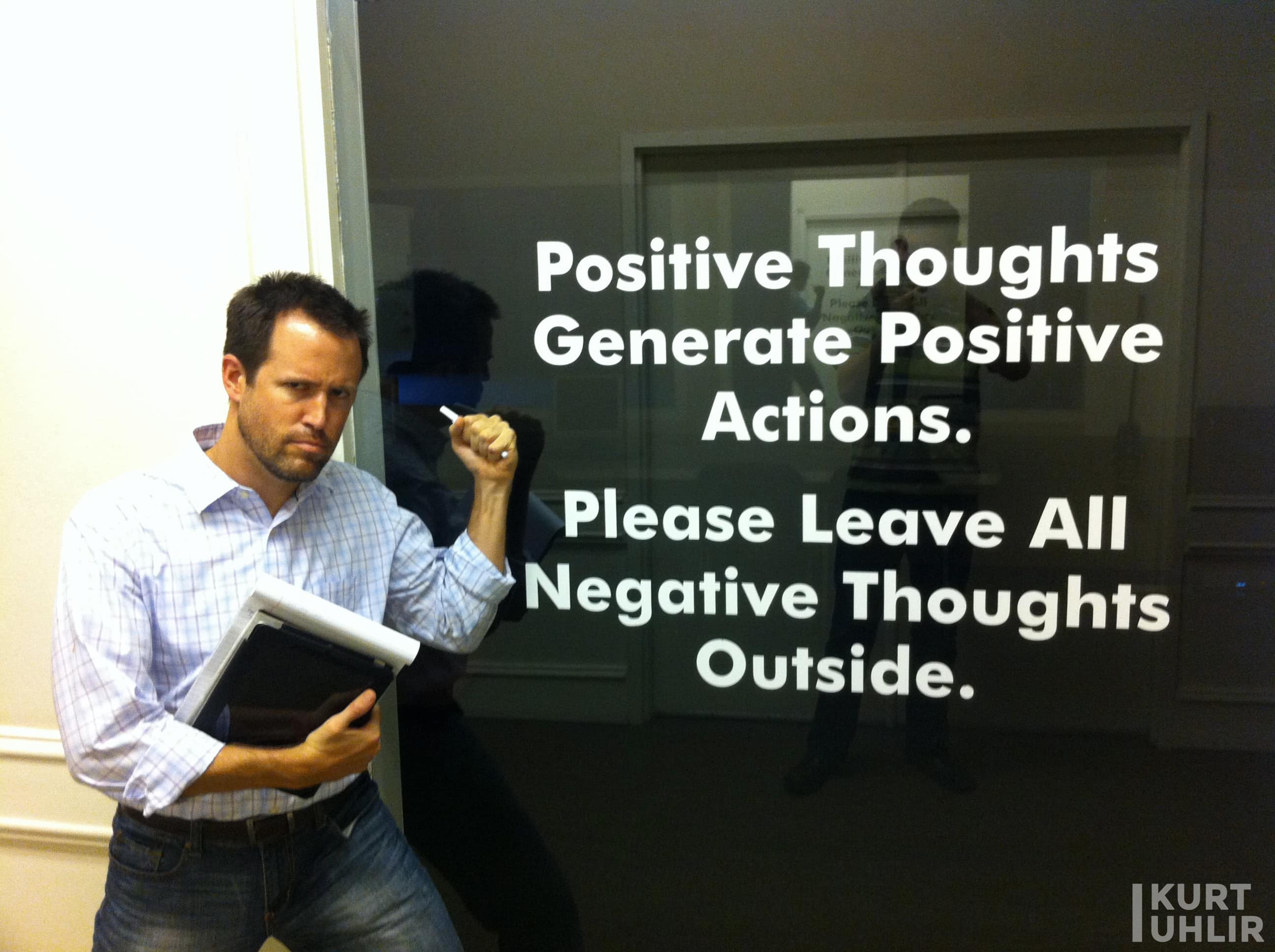 Kurt Uhlir having fun while doing customer discovery. Sign - Positive thoughts generate positive actions. Please leave all negative thoughts outside.