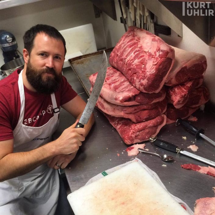 Kurt Uhlir cutting steaks for the Radical Mentoring Summit